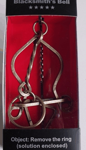 Enigma Metal Puzzles - Hard Yakka, on a Metal Stand